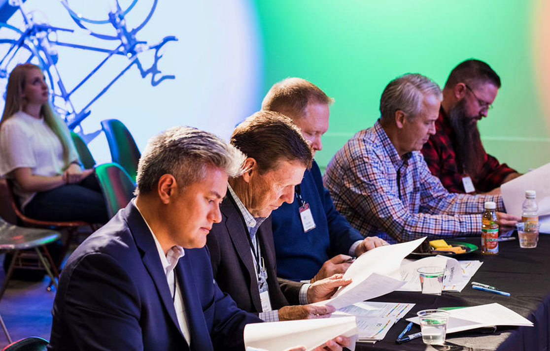 EO members reviewing materials at a table